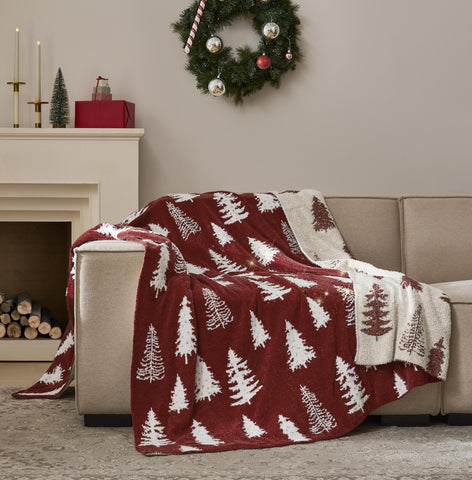 WDCOZY front view draped over couch showing red tree motif and cozy appeal