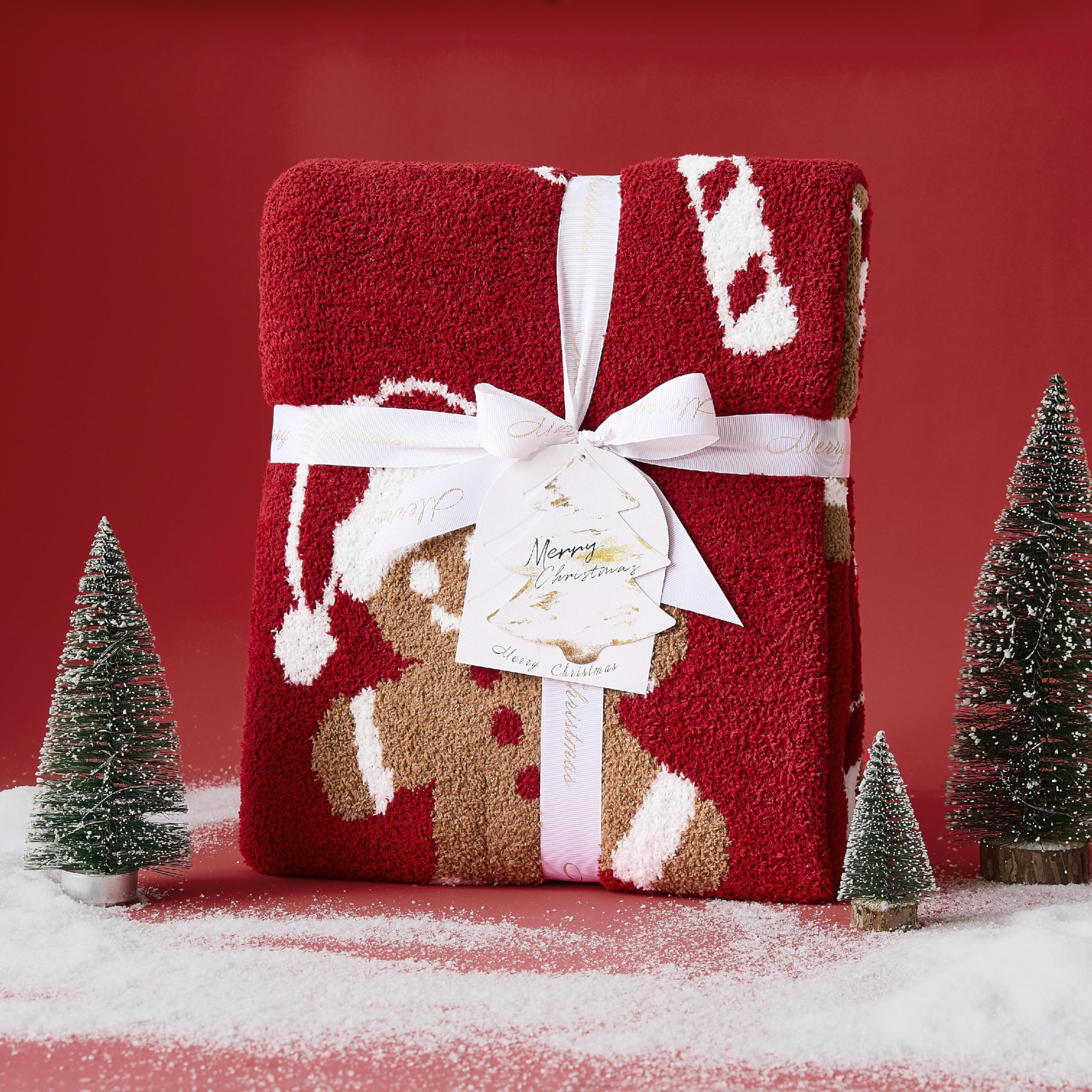 WDCOZY throw draped on sofa creating a warm, festive living room scene