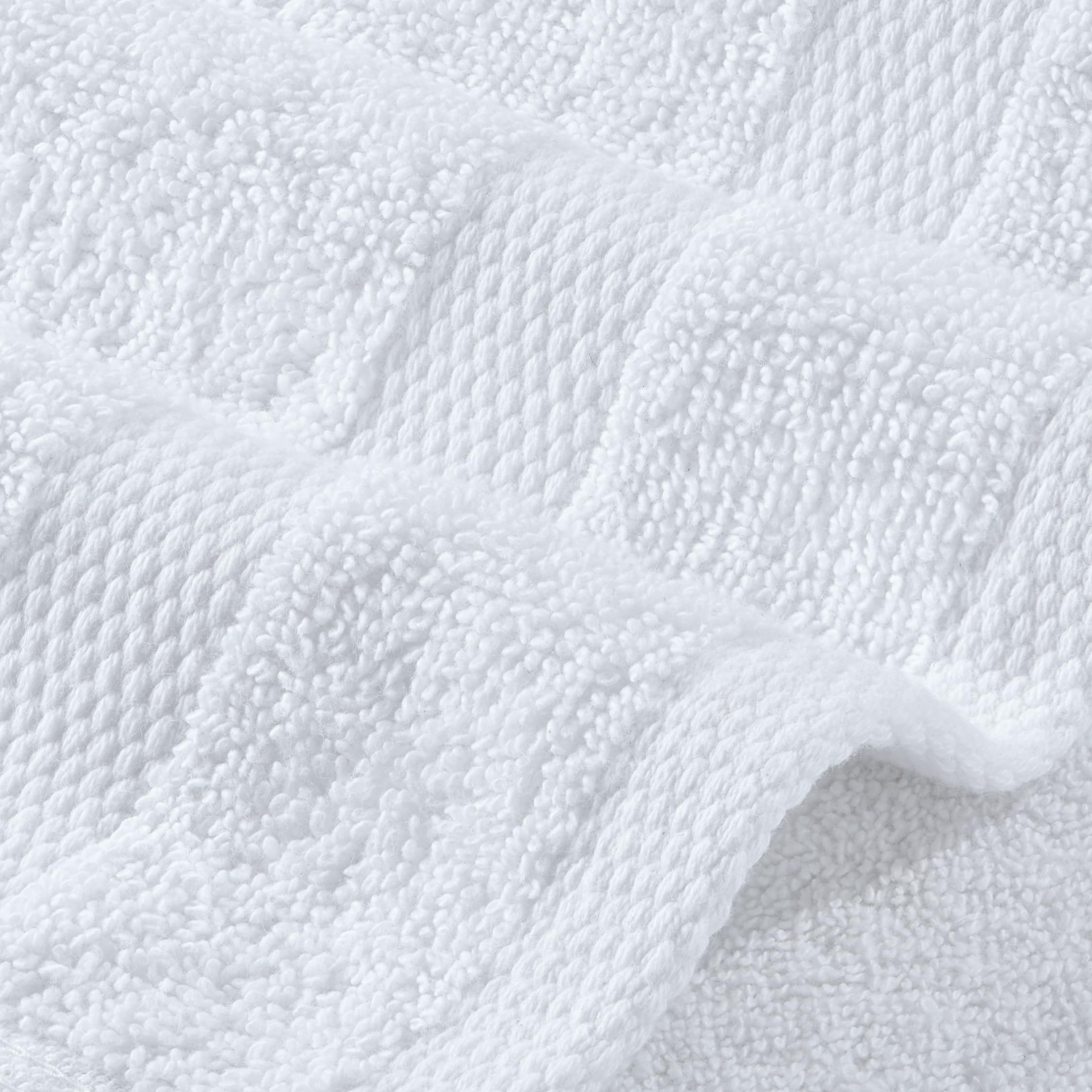 Stack of Wealuxe towels ready for laundry showing easy machine-wash care