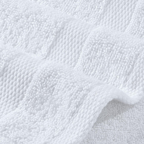 Stack of Wealuxe towels ready for laundry showing easy machine-wash care