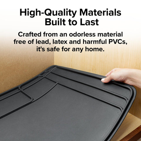 WeatherTech mat being wiped clean showing easy maintenance and quick cleanup