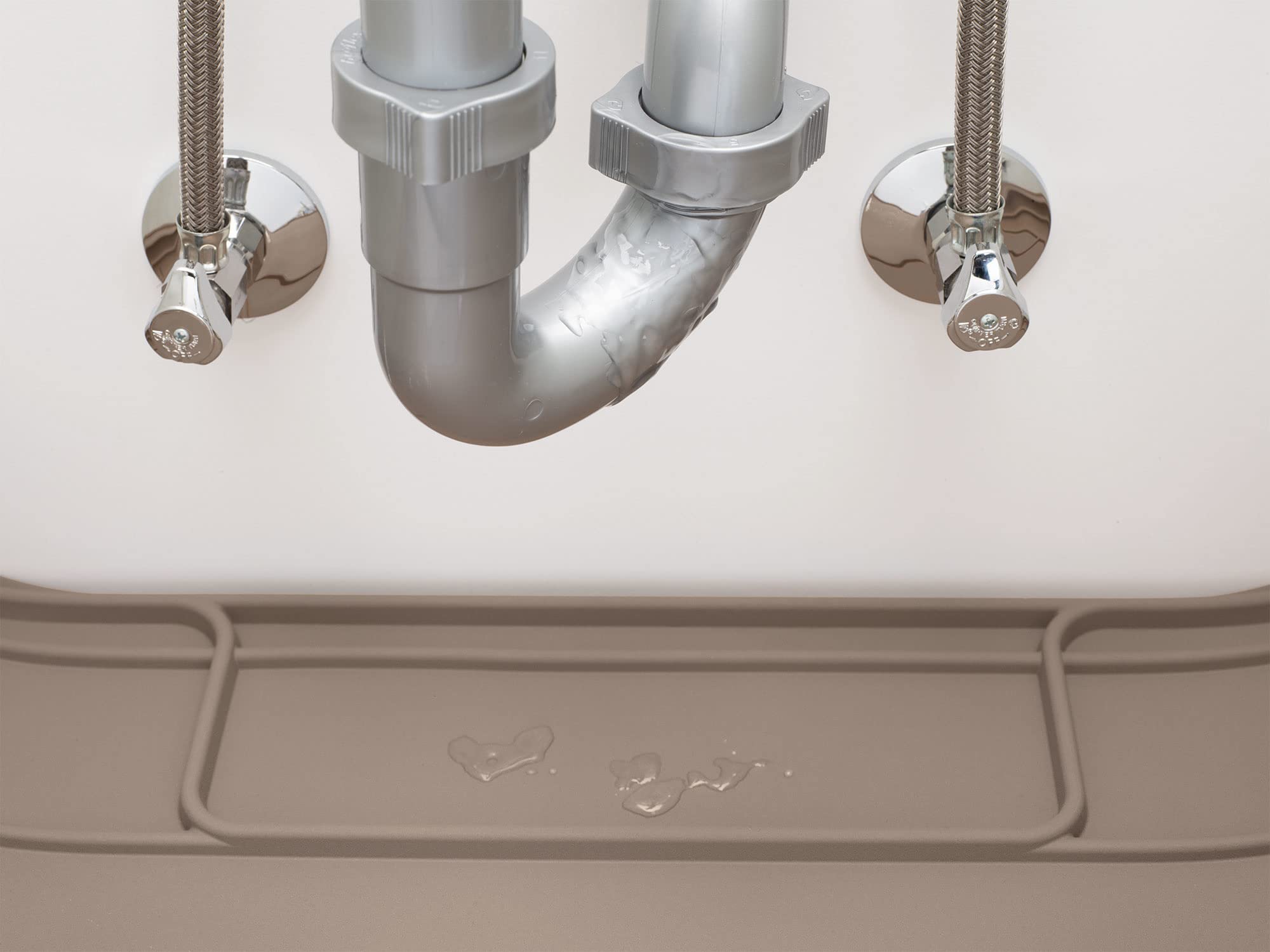 WeatherTech lifestyle shot of cabinet with SinkMat preventing water damage in kitchen