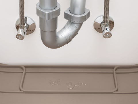 WeatherTech lifestyle shot of cabinet with SinkMat preventing water damage in kitchen