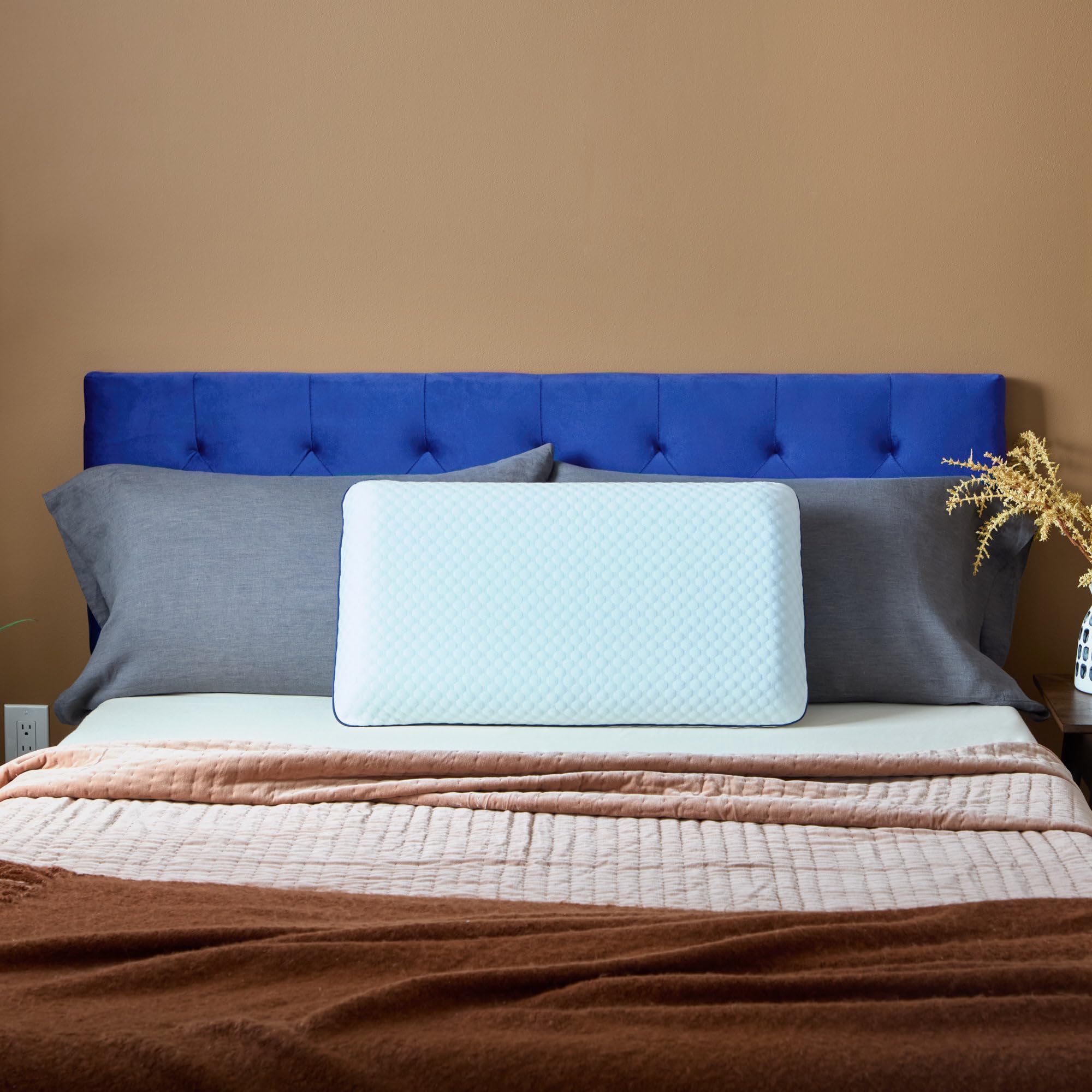 Weekender queen pillow next to ruler for accurate size and scale