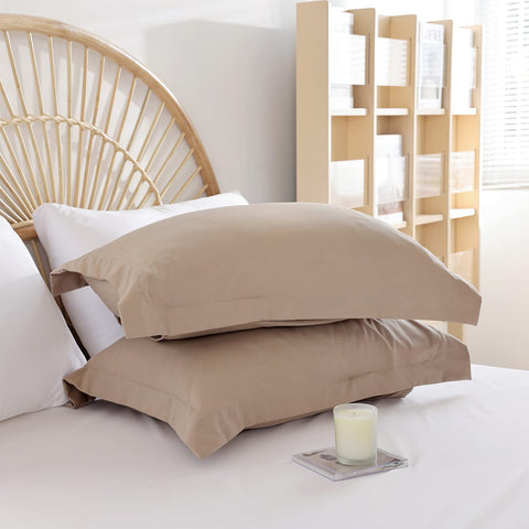 Weigelia pillow shams and white sheets arranged to show matching set and easy bed styling benefits