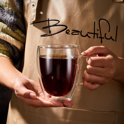 Wells scale comparison with a hand to show the lightweight 12 oz capacity advantage