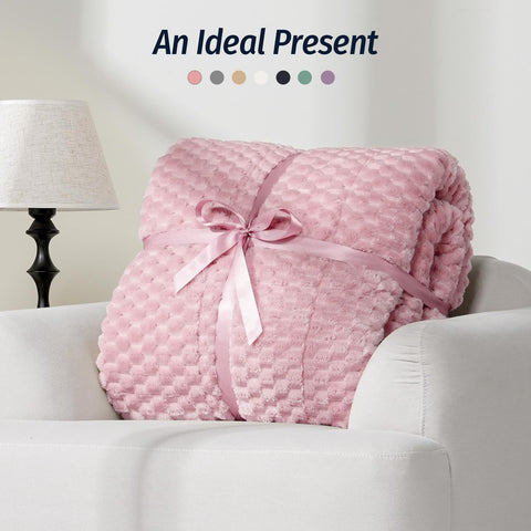 Wemore blanket draped on bed lifestyle showing full coverage and bedroom styling
