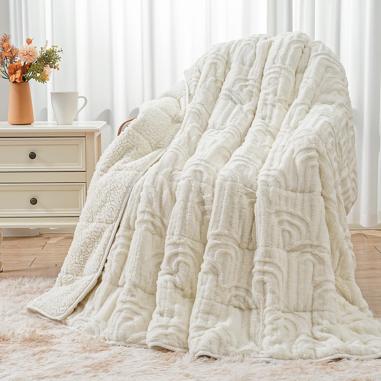 Wemore front view showing cream blanket on bed and soft decor benefit