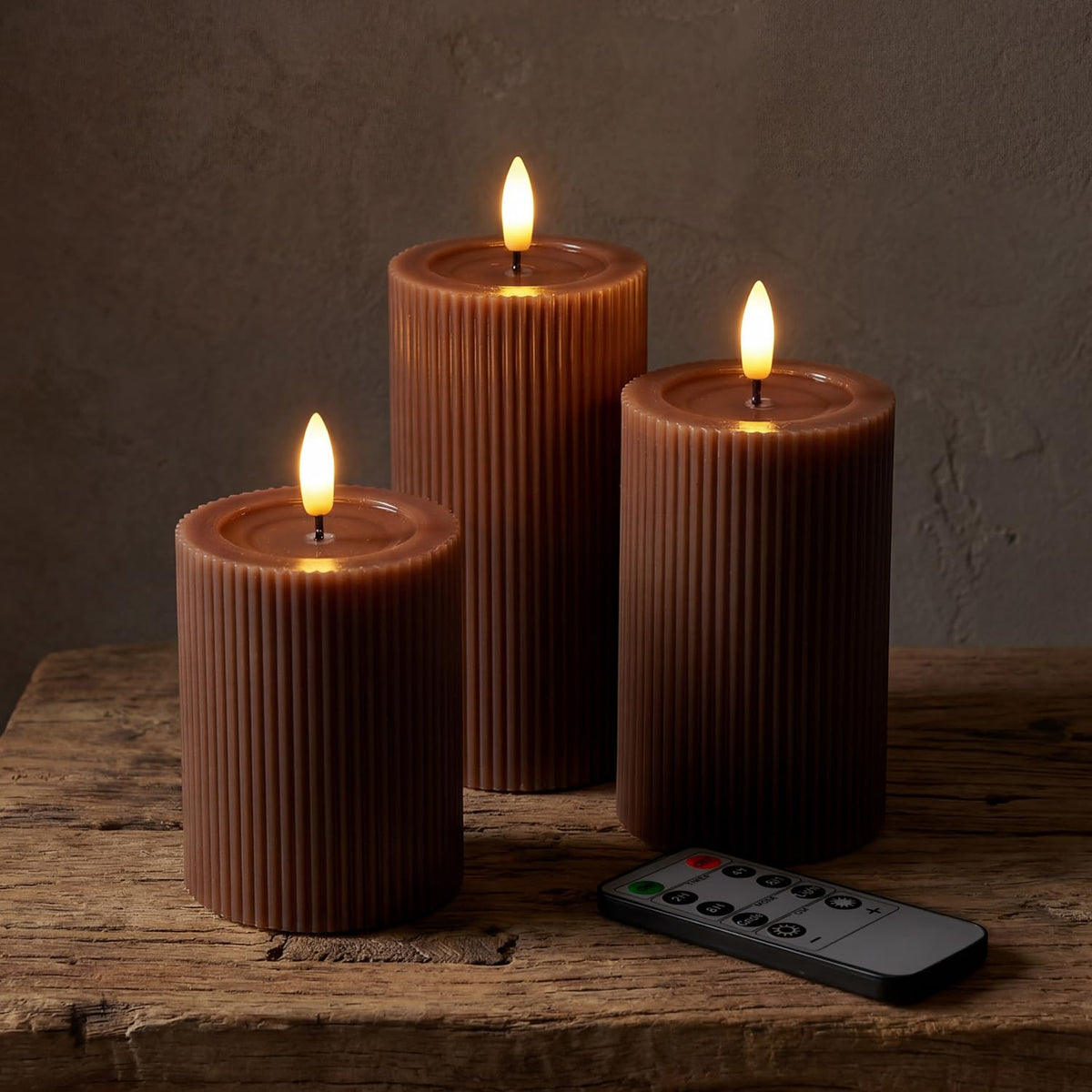West Ivory front view of three brown fluted LED pillar candles showing elegant decor