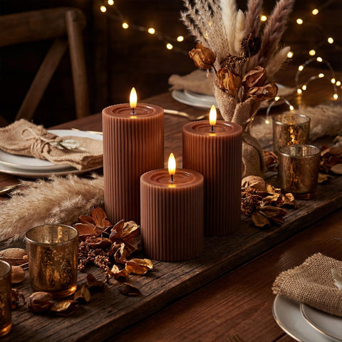 West Ivory candles beside a ruler showing 4, 5, and 6 inch size comparison