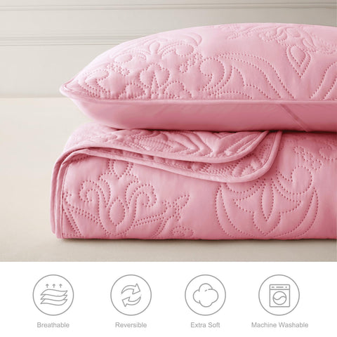 Whale Flotilla styled on a queen bed in a bedroom showing elegant decor upgrade