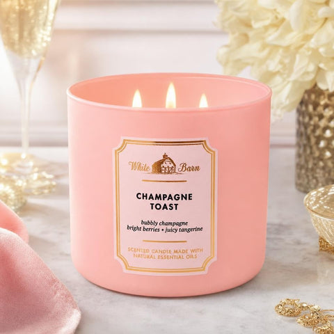White Barn Champagne Toast candles on a dining table creating festive atmosphere