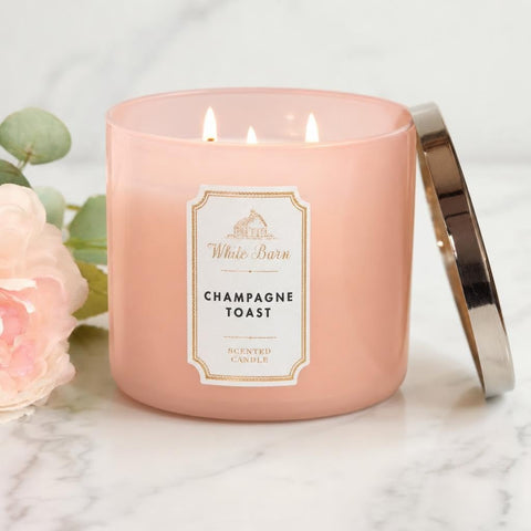 White Barn Champagne Toast three wicks lit delivering brighter glow and even fragrance
