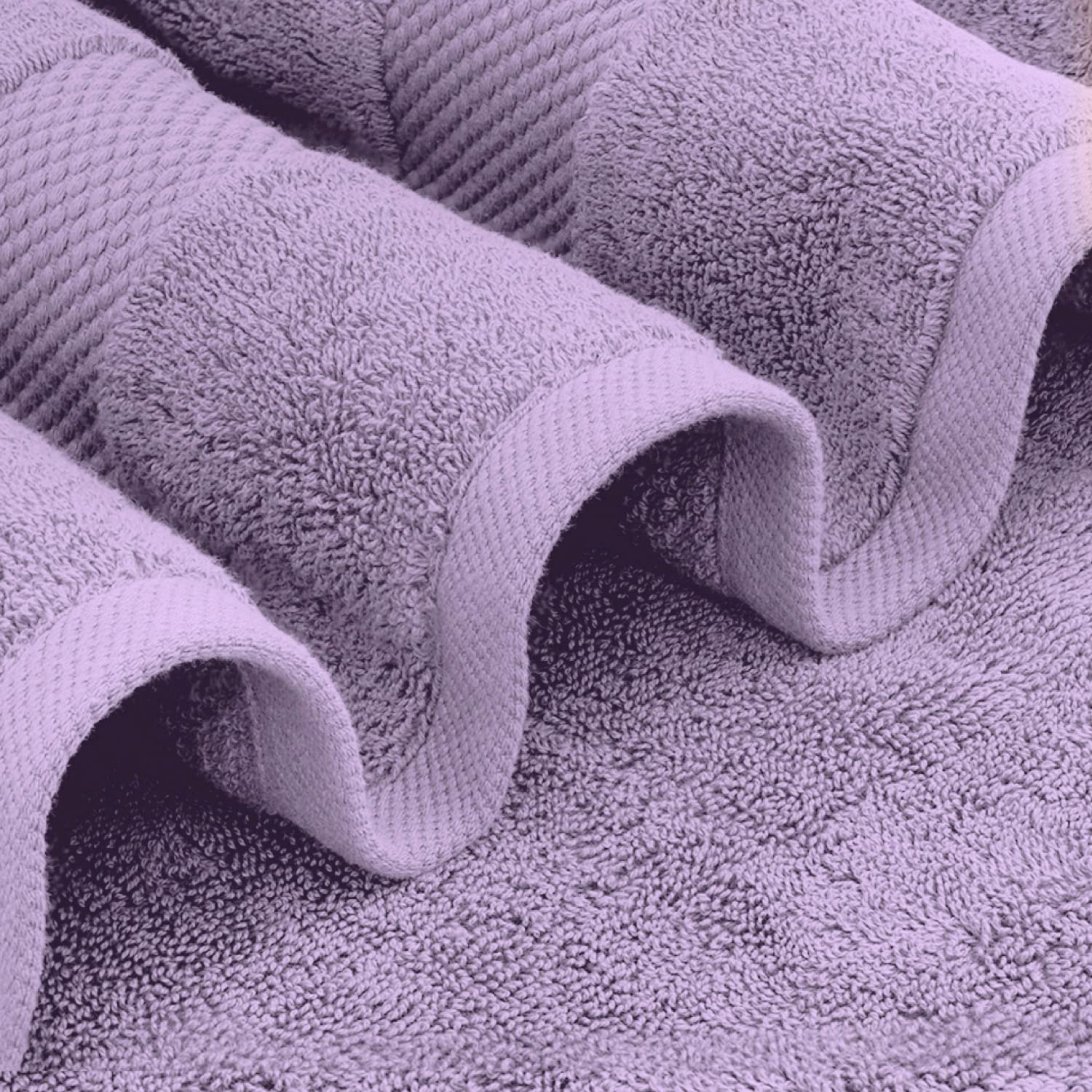 White Classic stacked bath towels demonstrating thickness and hotel-style luxury