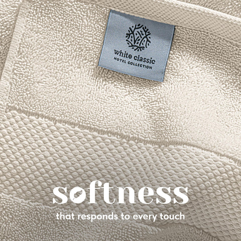 White Classic bath towel wrapped on user demonstrating softness and coverage