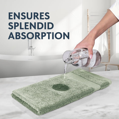 White Classic towel being used to dry hands demonstrating quick absorbency benefit