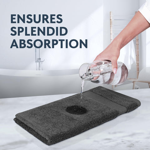 White Classic rolled towels on shelf conveying neat storage and ready-for-guest presentation