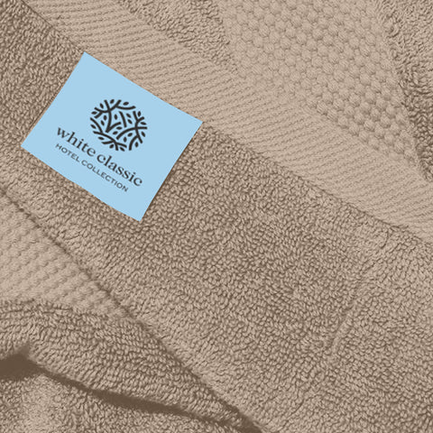 White Classic towel beside a ruler to show 16x30 inch size and generous coverage