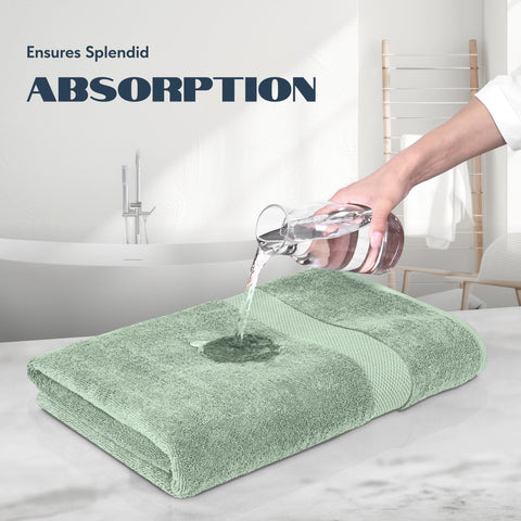 White Classic towel next to soap and glass showing scale and practical bathroom fit
