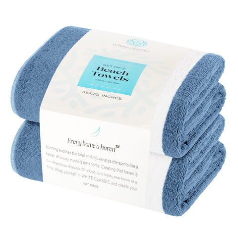 White Classic stacked two-pack towels in spa setting showing travel convenience and luxury