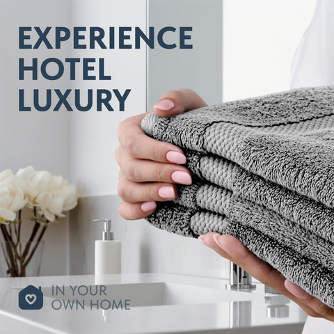 White Classic towel in use drying hands to show quick absorbency and softness