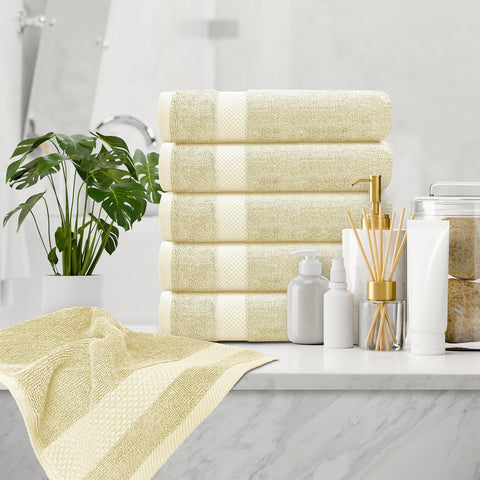 White Classic towel beside hand to show 16x30 inch size and practical scale
