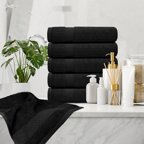 White Classic towel in use drying hands showing fast absorption and comfort
