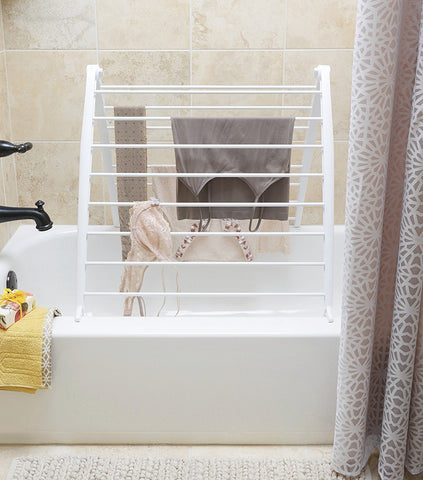 Whitmor Spacemaker leaned over bathtub demonstrating over-tub drying convenience
