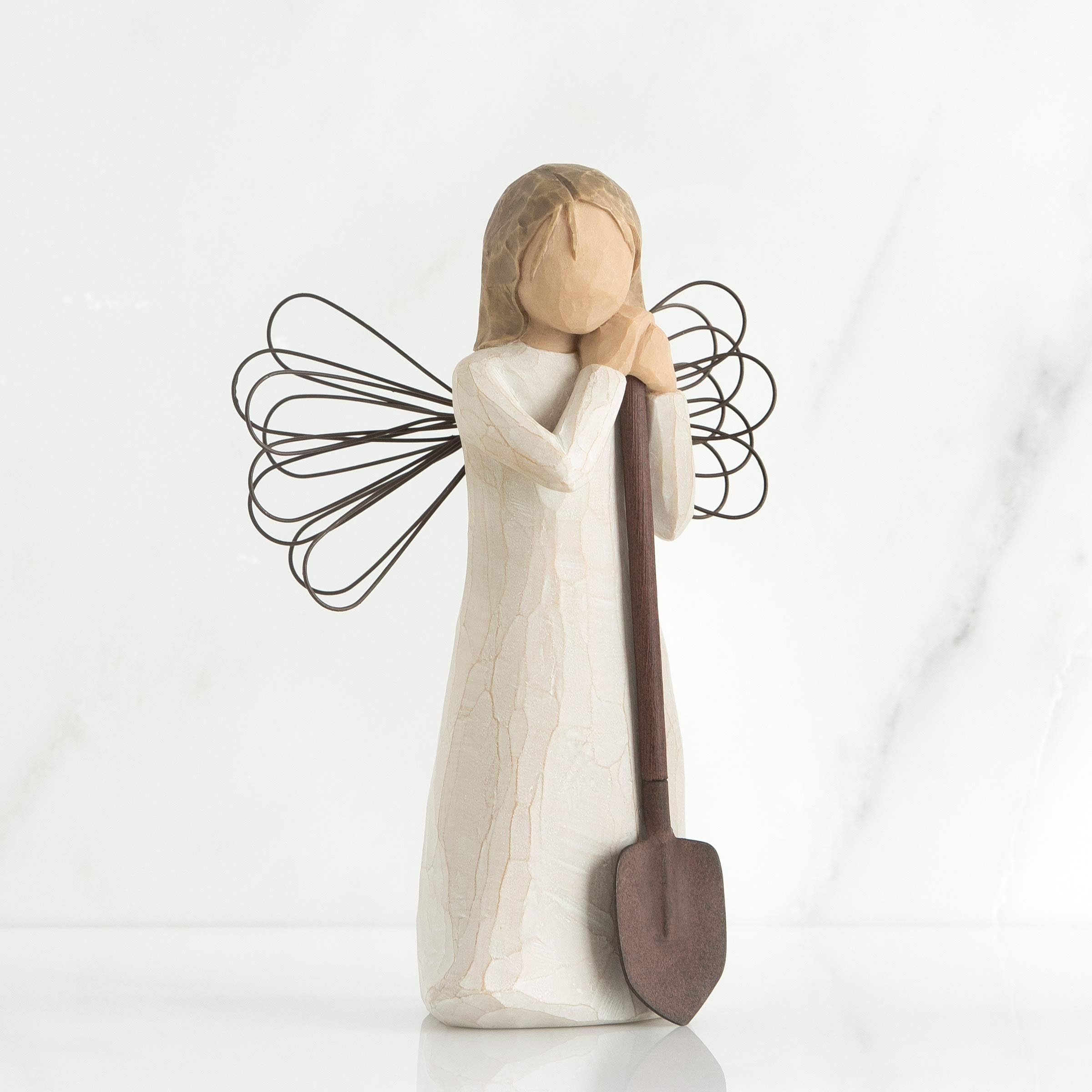 Willow Tree close-up of wire wings and brown metal shovel highlighting handcrafted detail