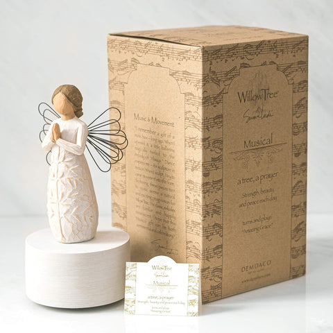 Willow Tree on mantel shelf playing Amazing Grace creating calm atmosphere