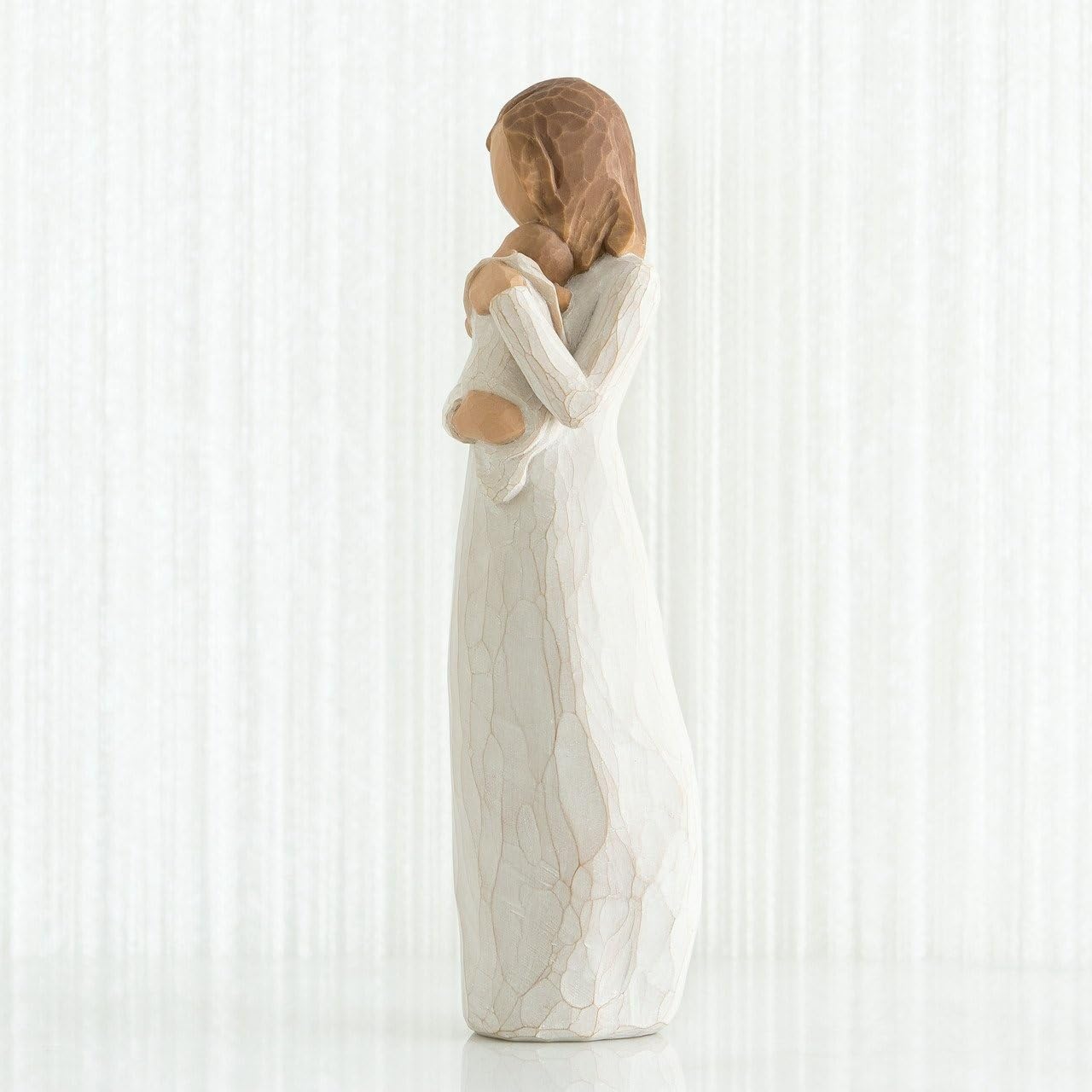 Willow Tree Angel of Mine on shelf with other decor, illustrating scale and warmth