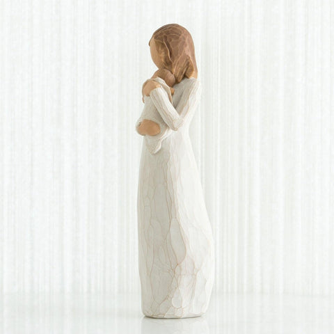 Willow Tree Angel of Mine on shelf with other decor, illustrating scale and warmth