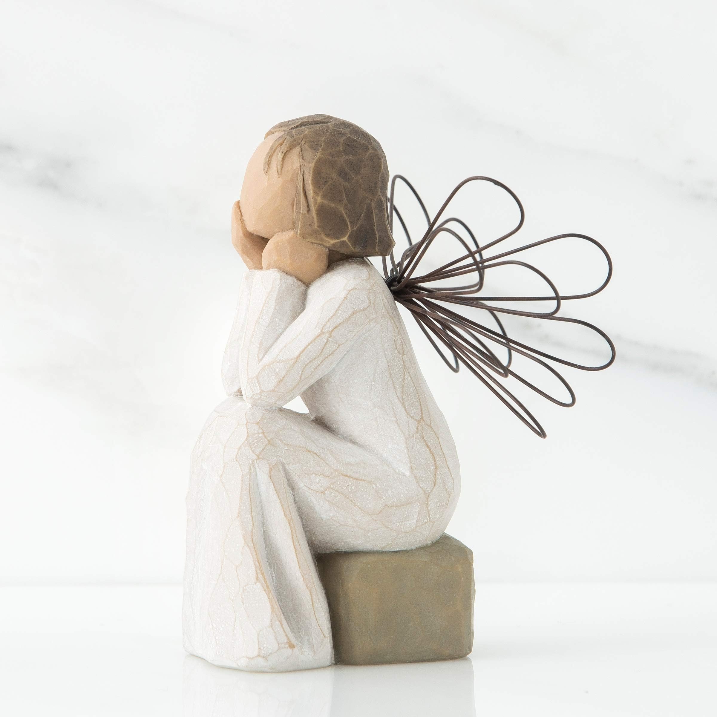 Willow Tree wire wings close-up emphasizing handcrafted contrast and texture