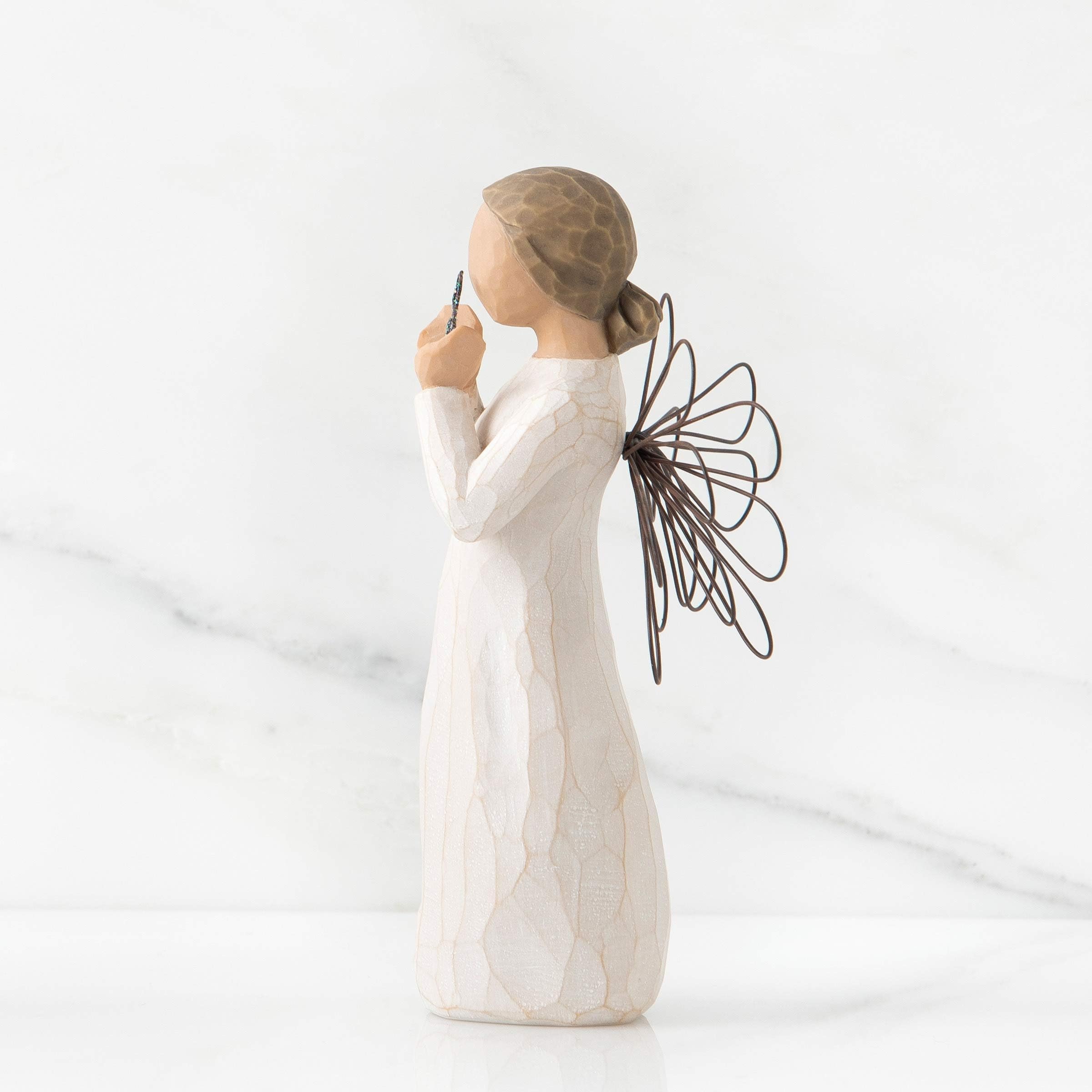 Willow Tree Bright Star held in hand to show 5.5-inch scale and tabletop suitability