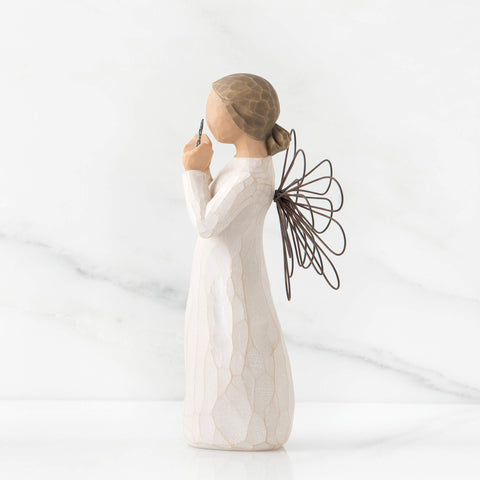 Willow Tree Bright Star held in hand to show 5.5-inch scale and tabletop suitability