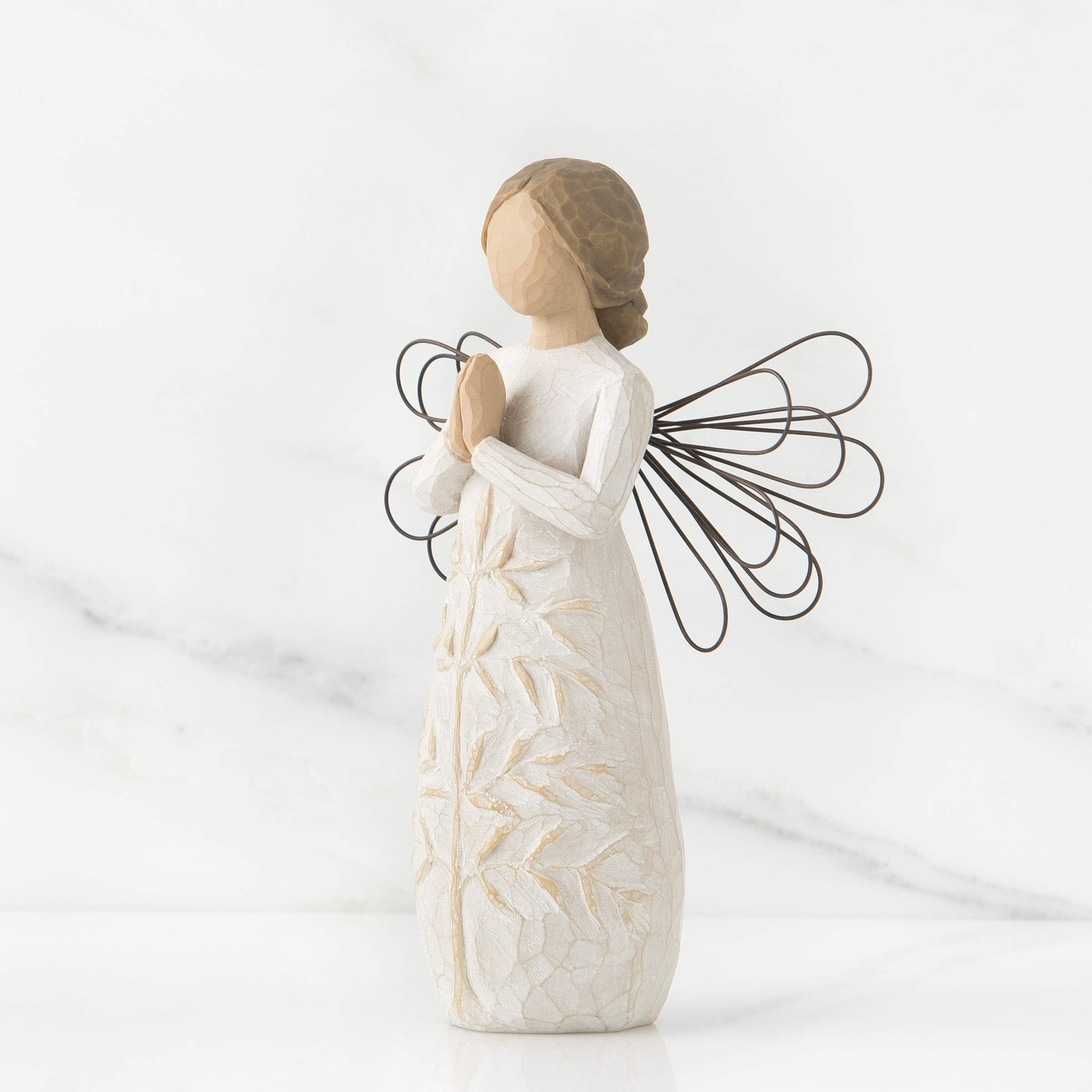 Willow Tree carved tree detail on dress, highlighting symbolic craftsmanship
