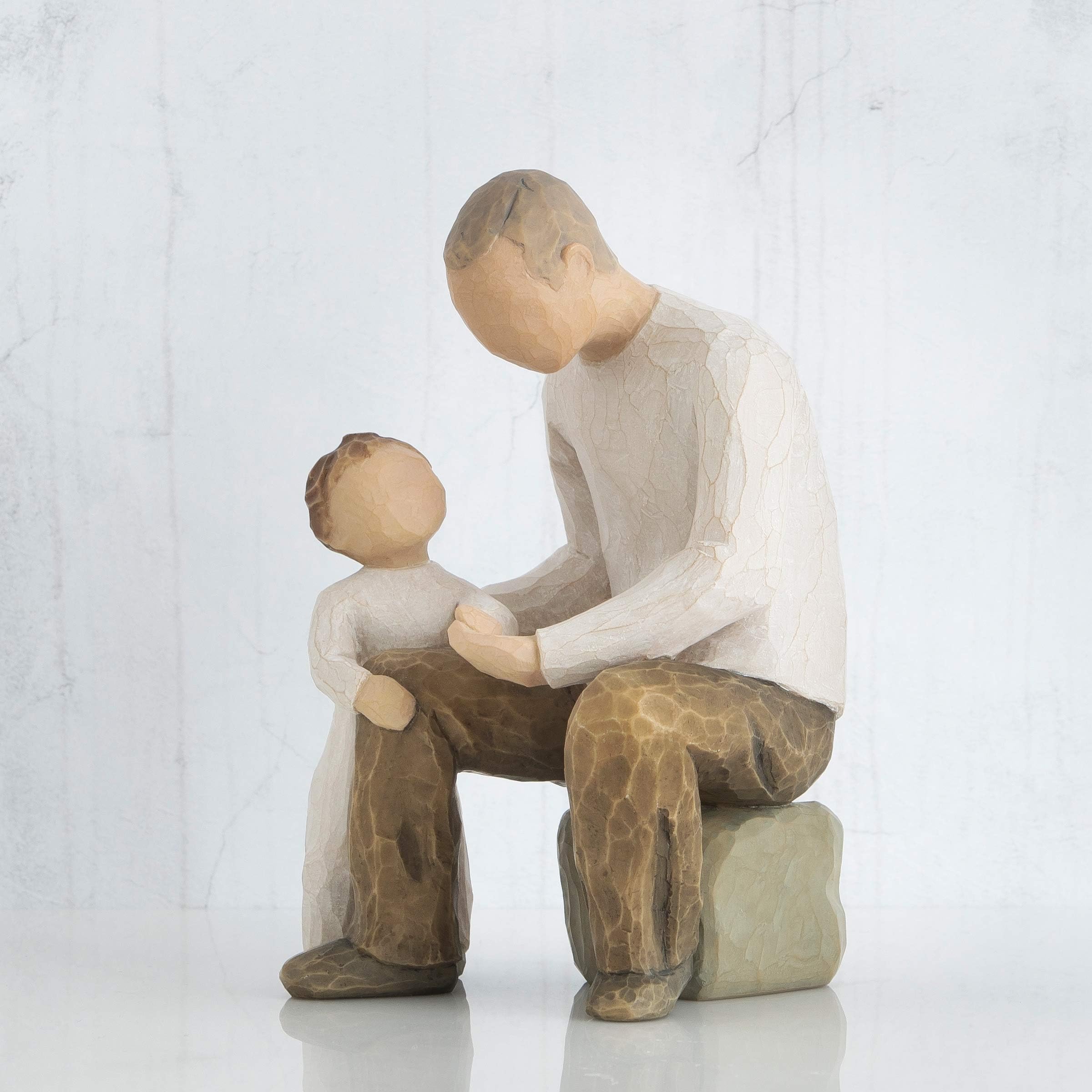 Willow Tree figure displayed in a nursery to suggest gifting and sentimental decor