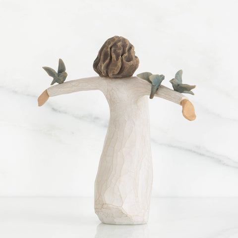 Willow Tree side profile showing dress texture and carving, emphasizes artisanal finish