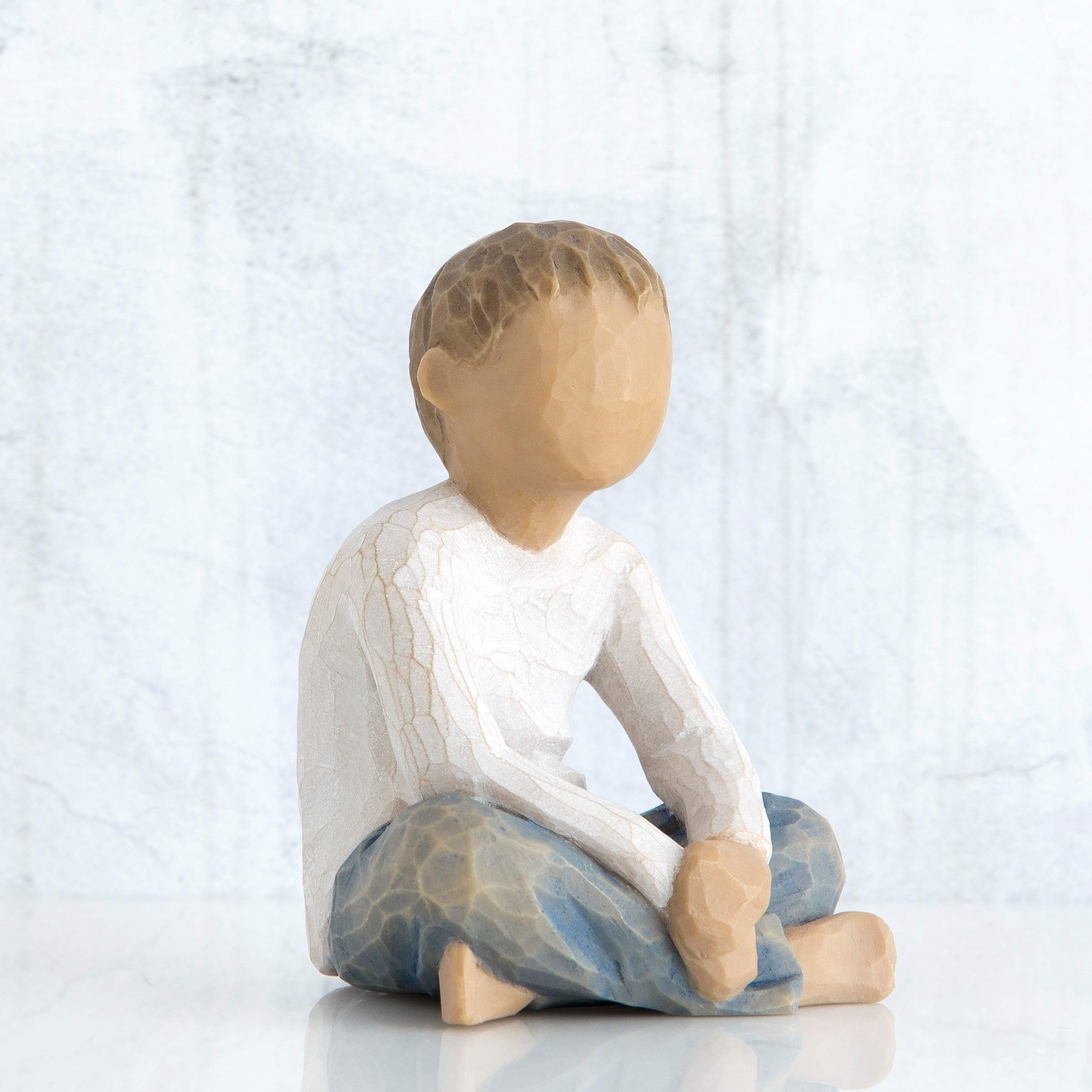 Willow Tree figure grouped with other pieces illustrating family arrangement and storytelling