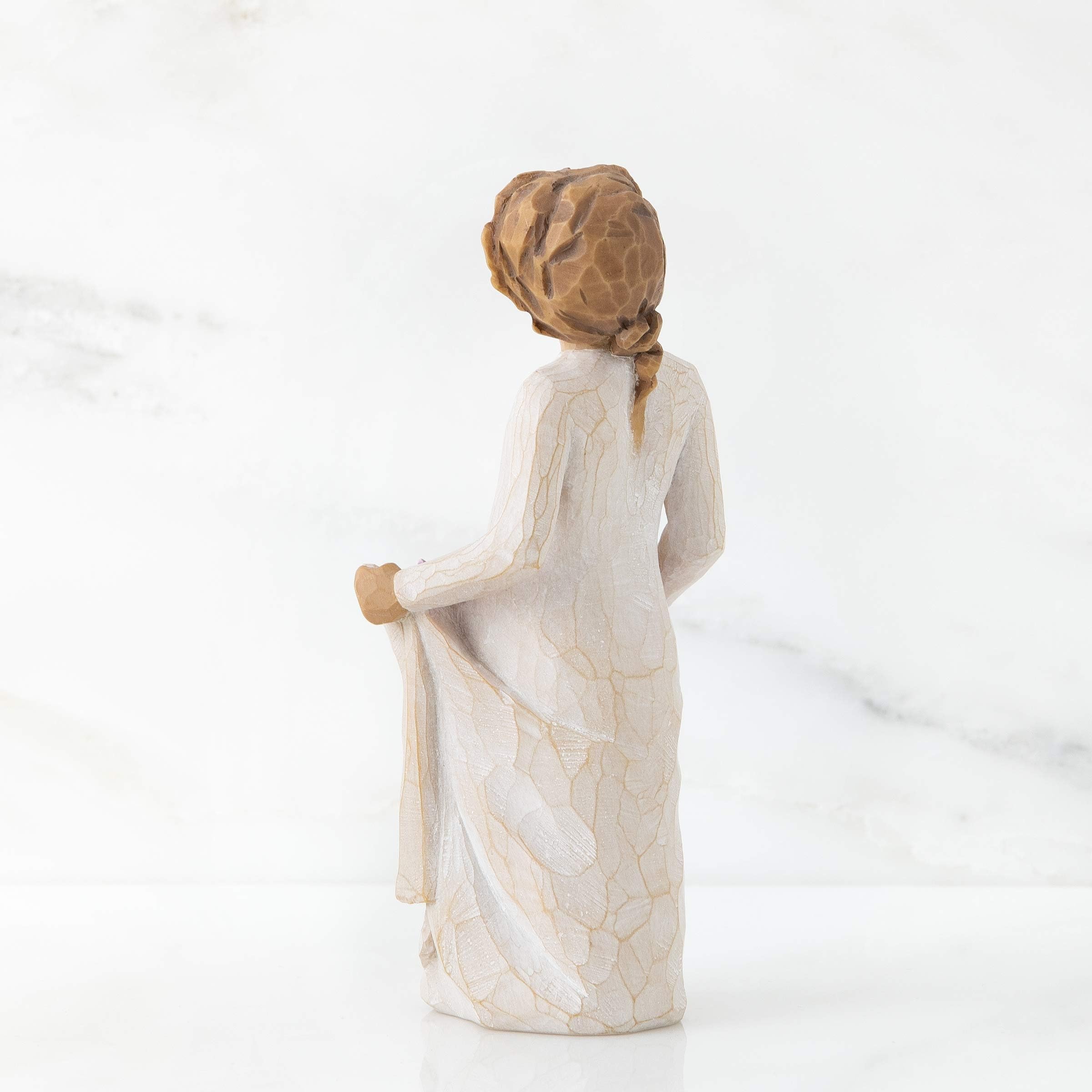 Willow Tree held in hand to show scale and delicate craftsmanship benefits
