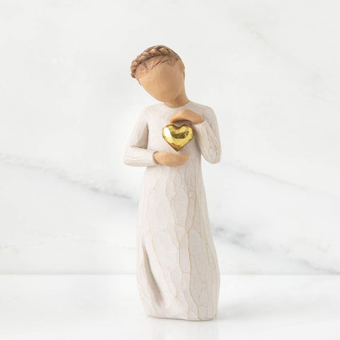 Willow Tree close-up of gold-leaf heart detail highlighting artisan finish and warmth