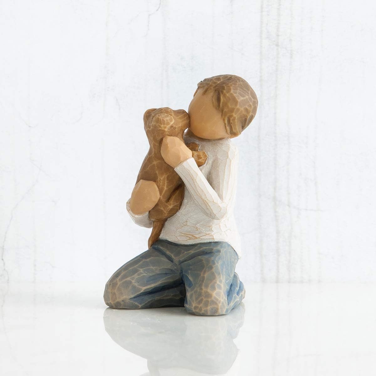 Willow Tree Kindness (boy) close-up of face and hands highlighting hand-painted texture