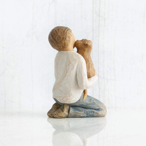 Willow Tree Kindness (boy) detailed shot of golden dog emphasizing affectionate focus