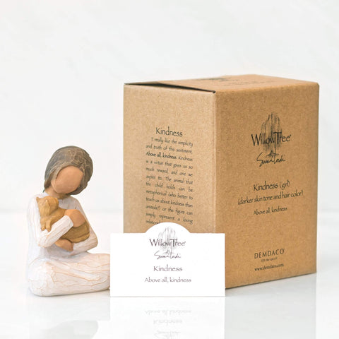 Willow Tree figure on a living room shelf adding gentle decor and emotional warmth