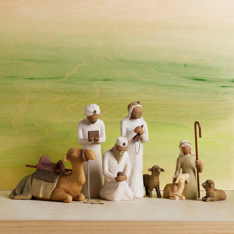 Willow Tree nativity on mantel styled with greenery for peaceful holiday display