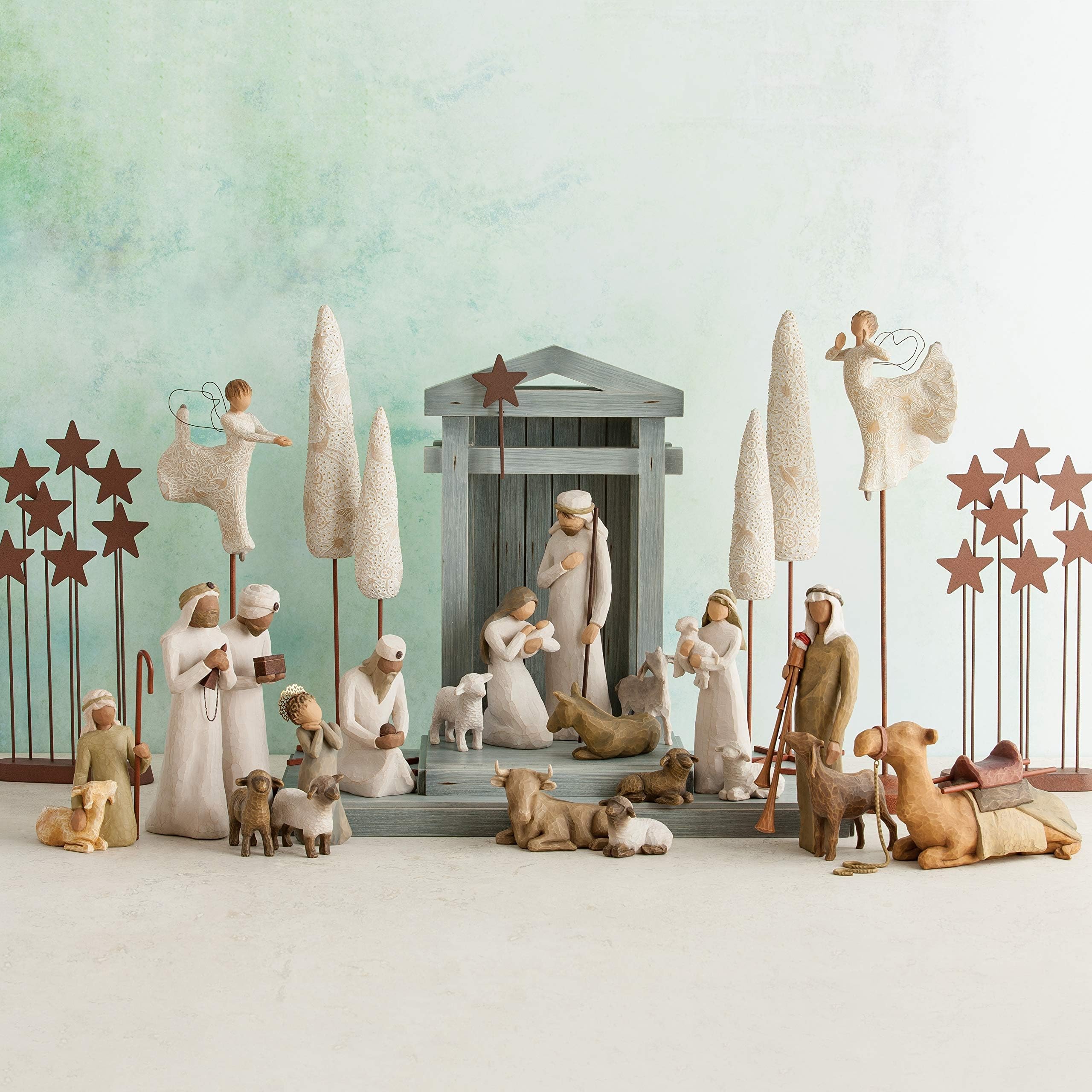 Willow Tree displayed on mantel in holiday setting conveying timeless elegance
