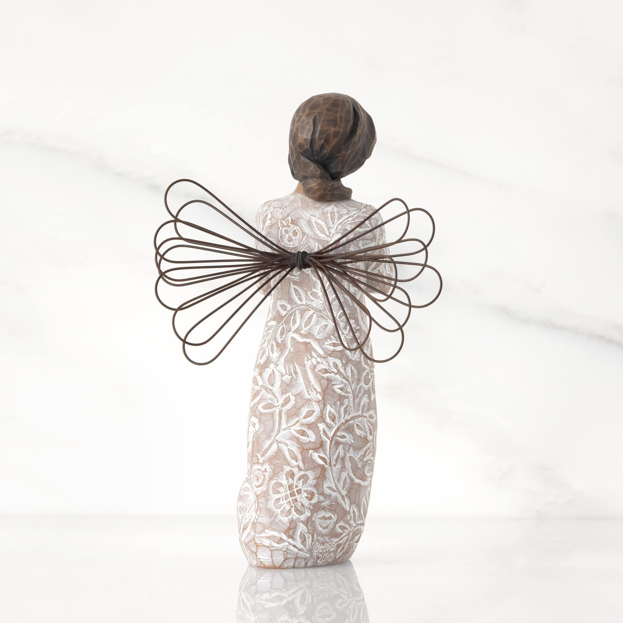 Willow Tree remembrance face and hands detail conveying calm comfort