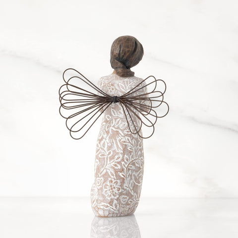Willow Tree remembrance face and hands detail conveying calm comfort