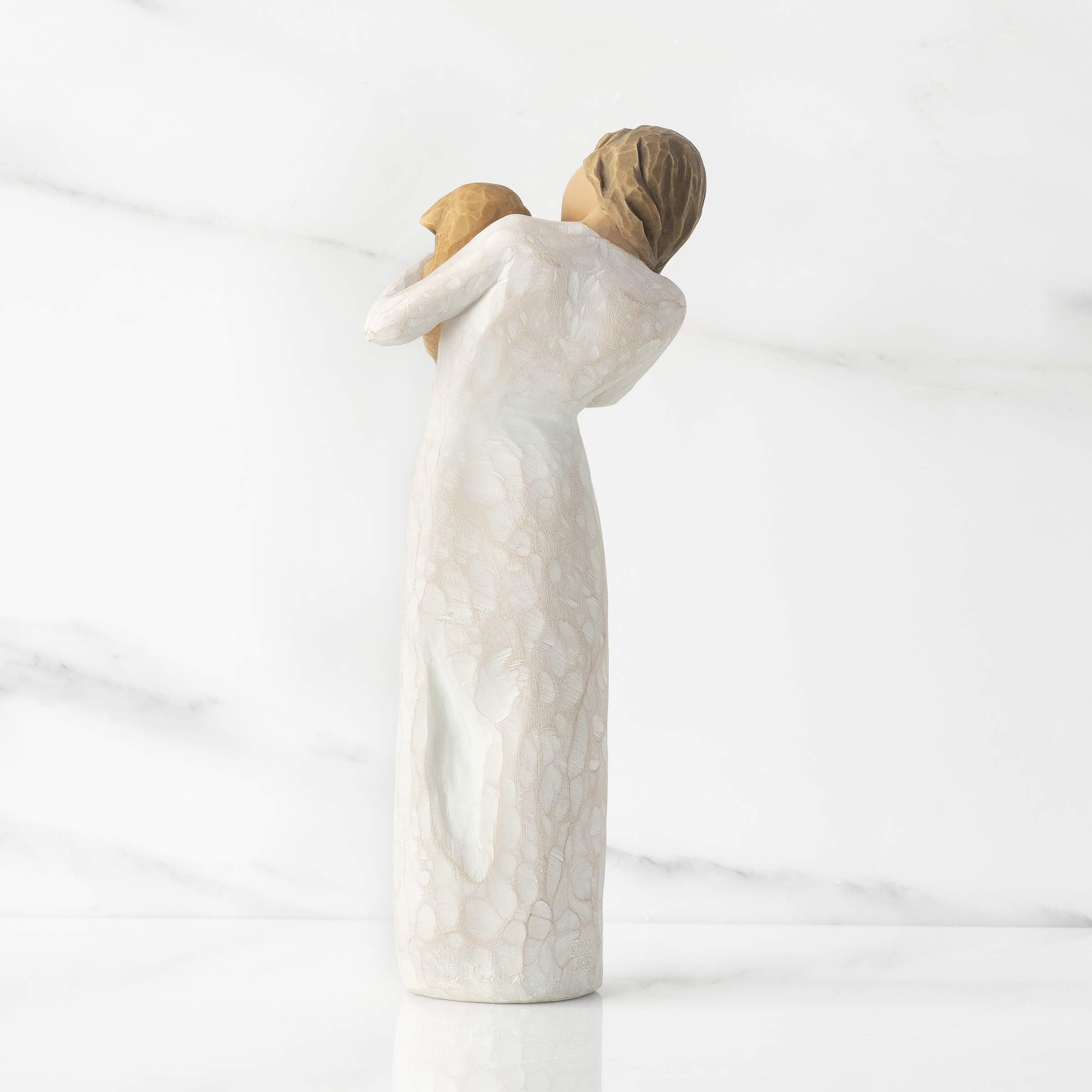 Willow Tree side profile of sculpted figure showing posture and dress folds for warmth
