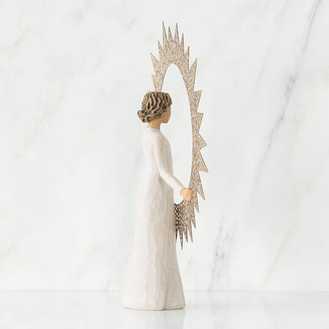 Willow Tree topper photographed on a decorated tree creating warm ambiance